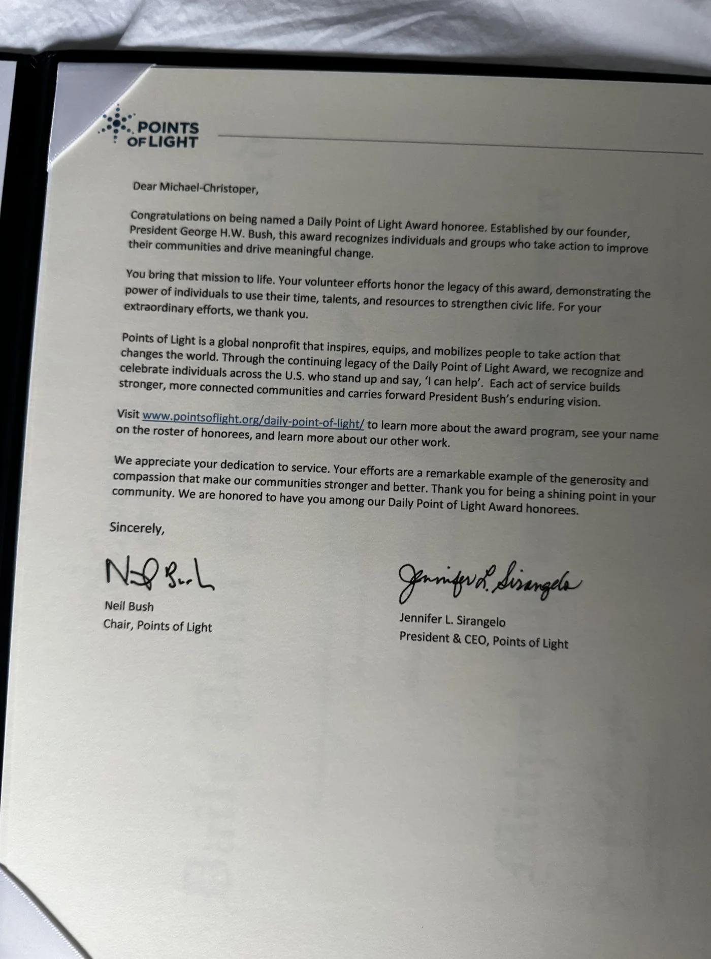 Congratulatory letter from Points of Light naming Michael-Christopher Suman a Daily Point of Light Award honoree, signed by Chair Neil Bush and President & CEO Jennifer L. Sirangelo